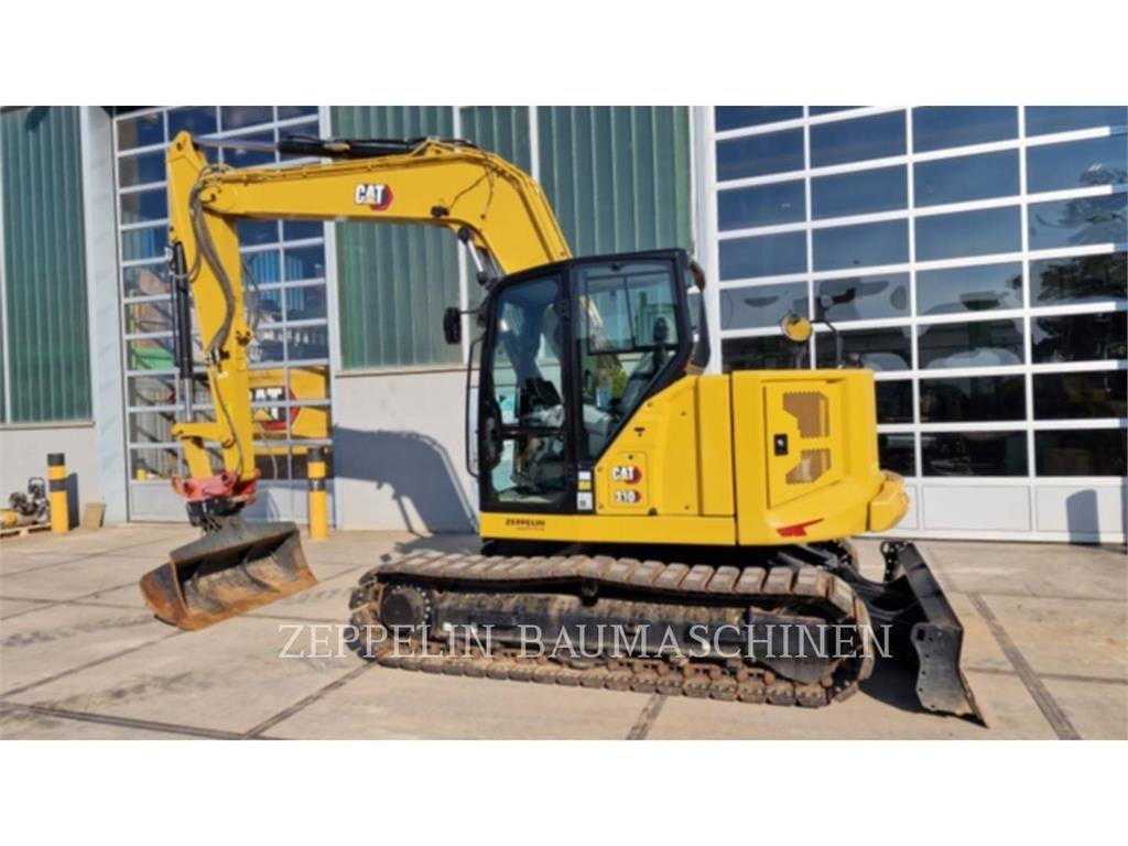 CAT 310 Rupsgraafmachines