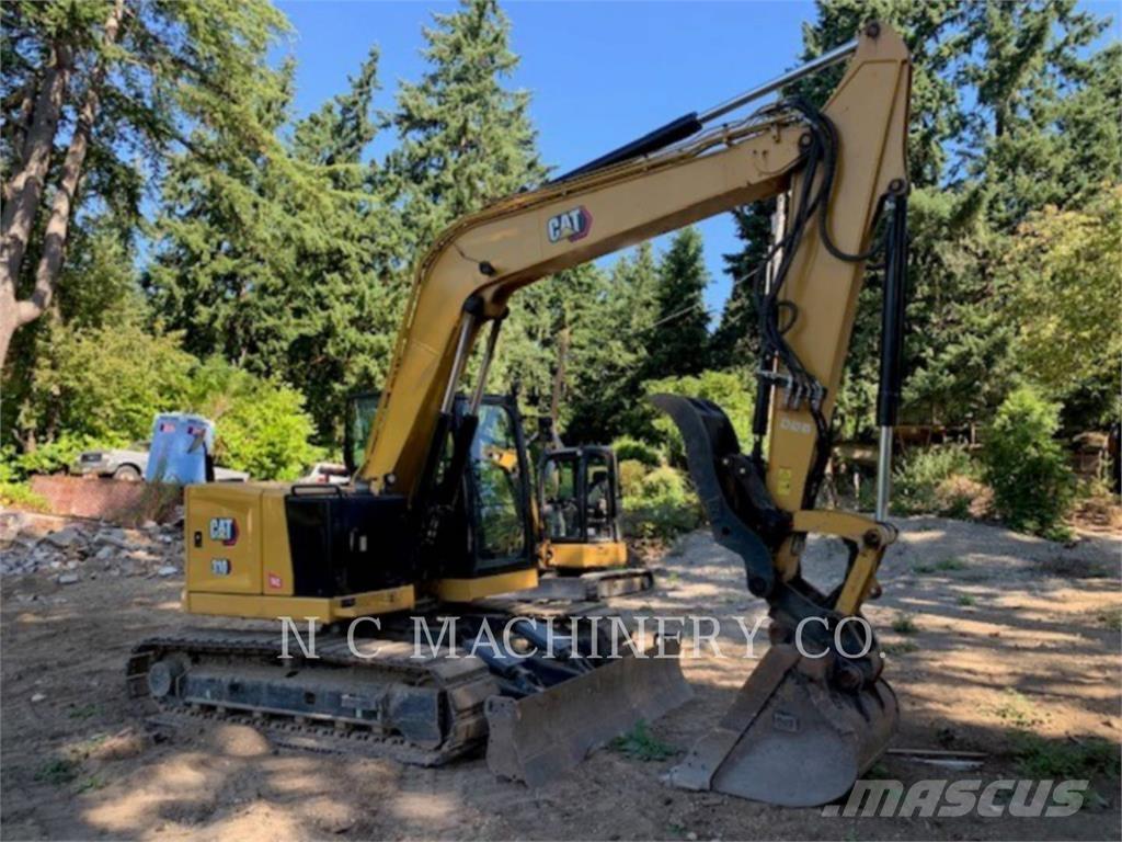 CAT 310 Rupsgraafmachines