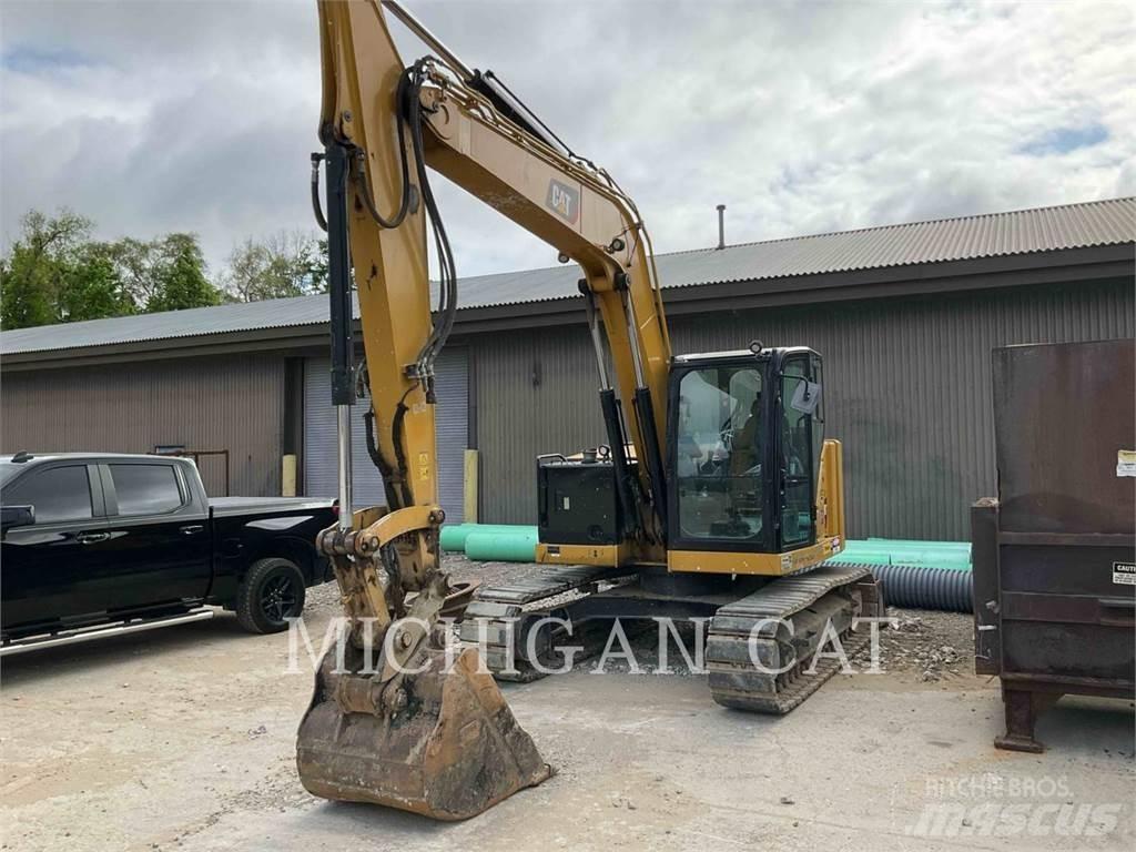 CAT 310 AQ Rupsgraafmachines