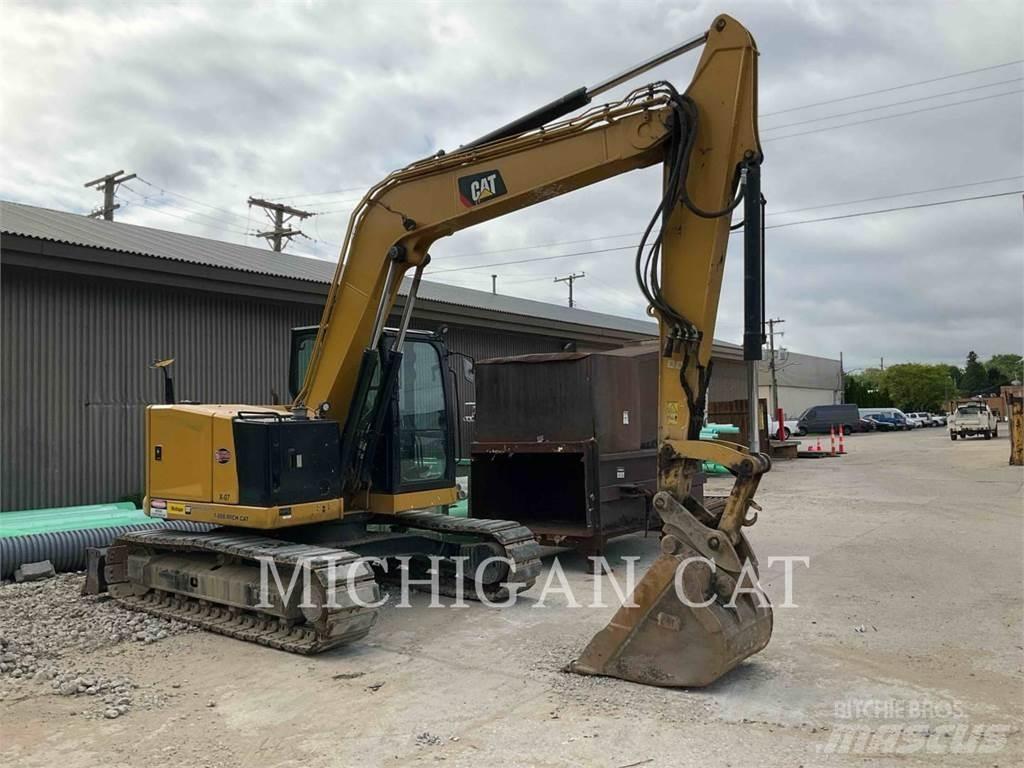 CAT 310 AQ Rupsgraafmachines