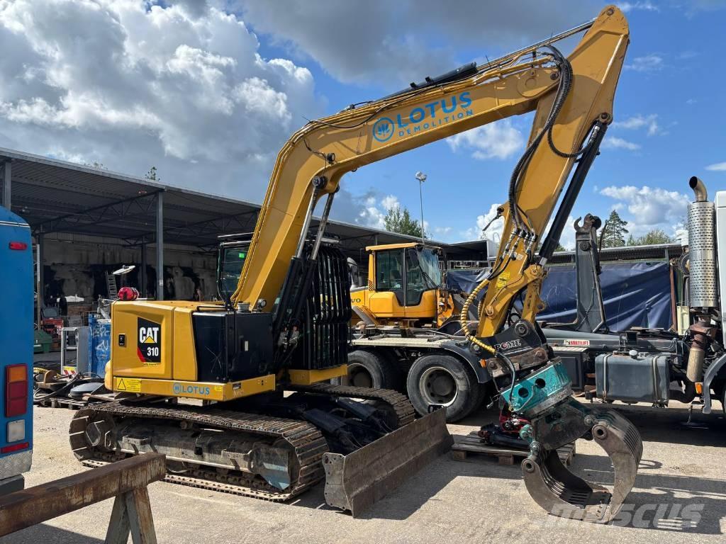 CAT 310 Rupsgraafmachines