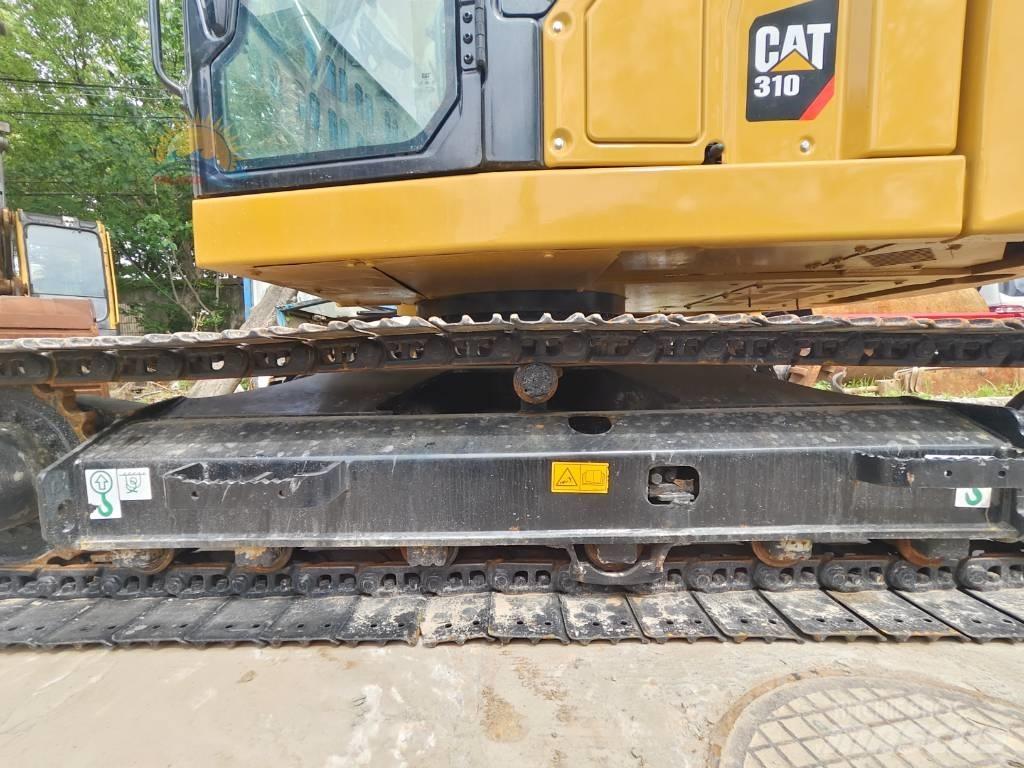 CAT 310 Rupsgraafmachines