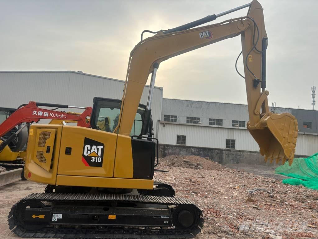 CAT 310 Rupsgraafmachines