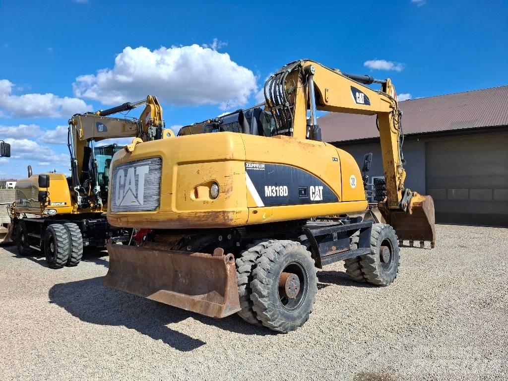 CAT 318 Wielgraafmachines