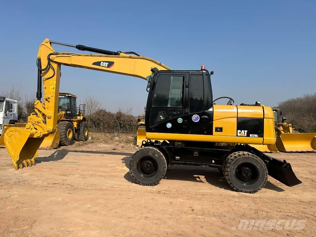 CAT M 320D Wielgraafmachines