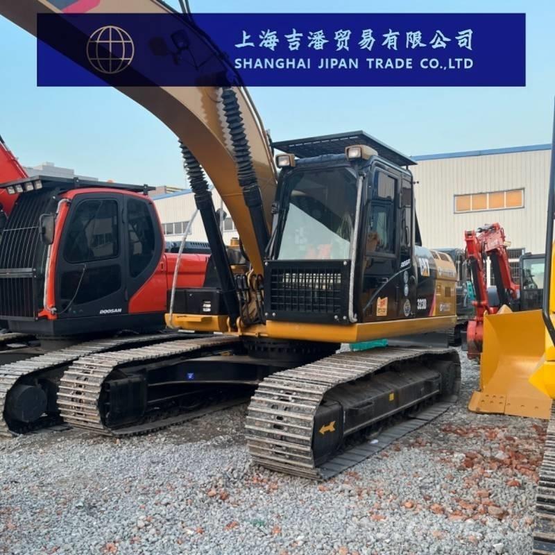 CAT 323 Rupsgraafmachines