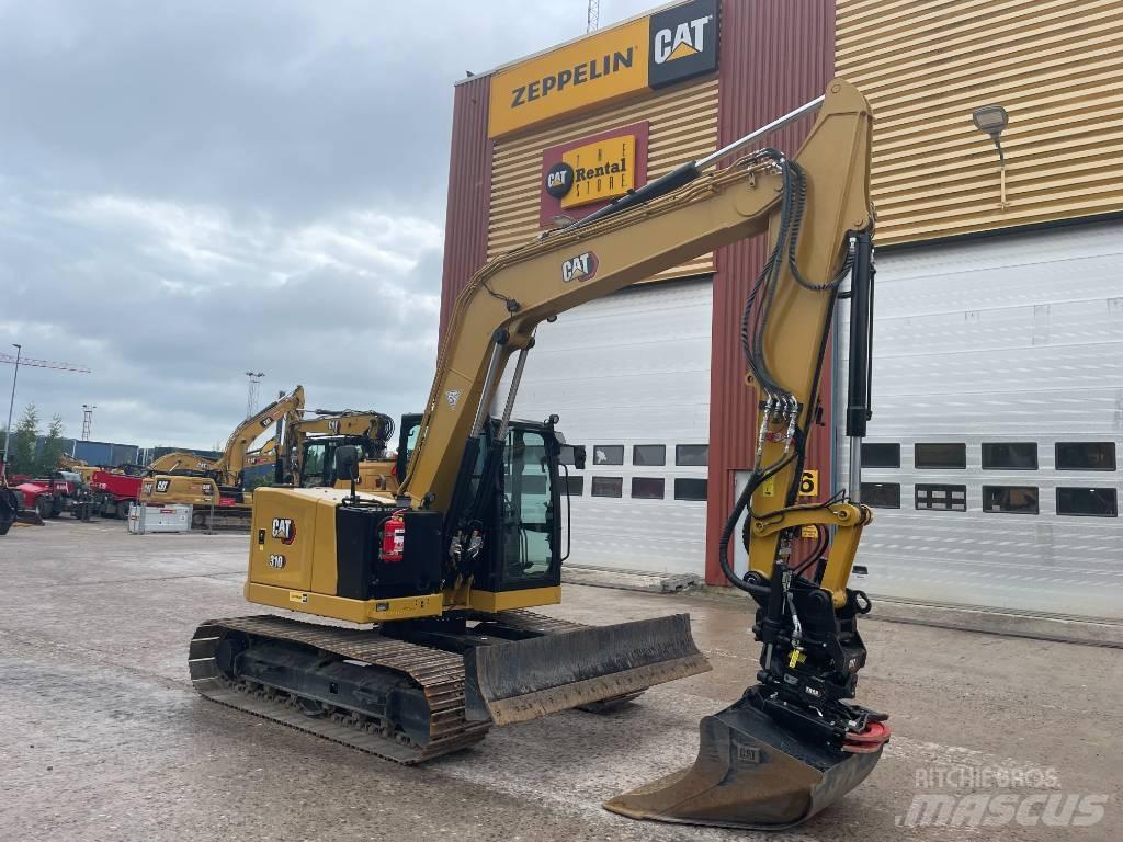 CAT 310 Rupsgraafmachines