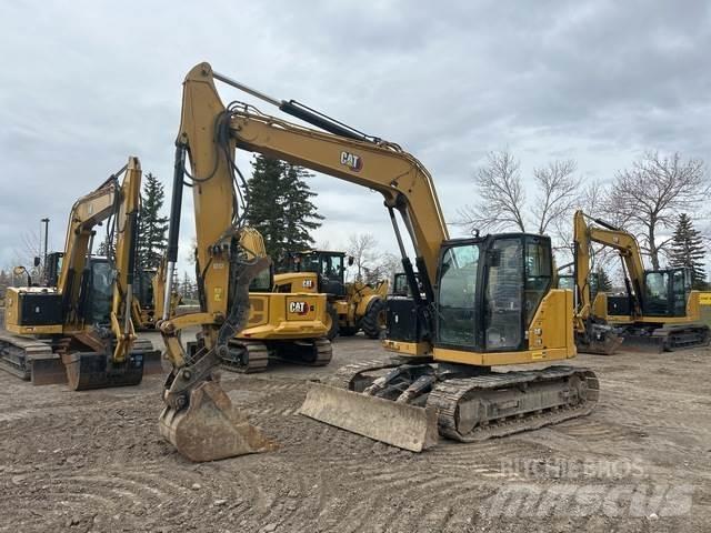 CAT 310 Rupsgraafmachines