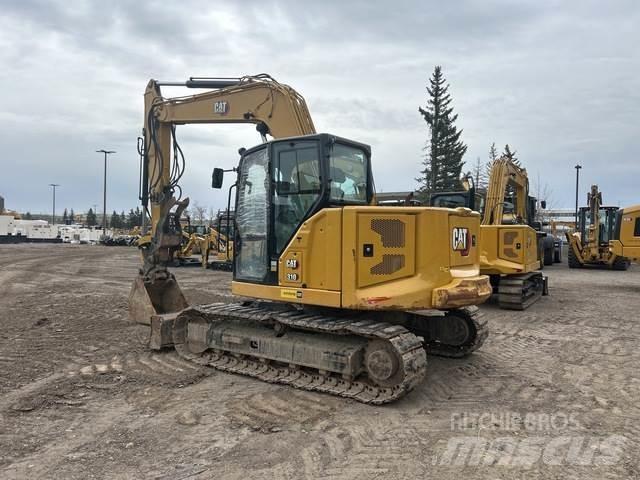 CAT 310 Rupsgraafmachines