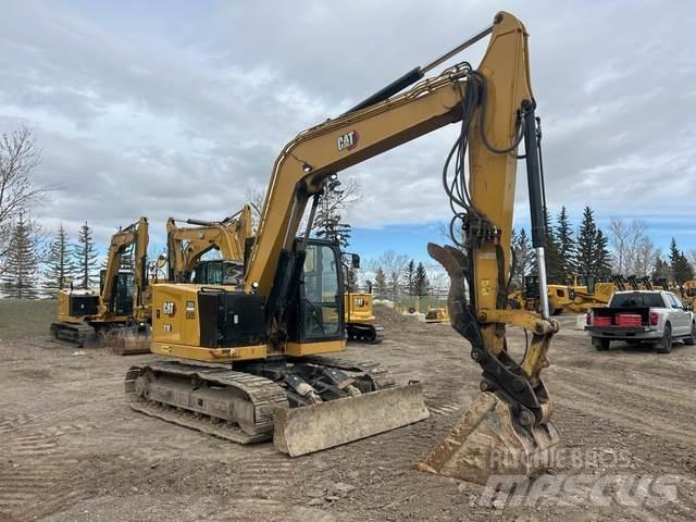 CAT 310 Rupsgraafmachines