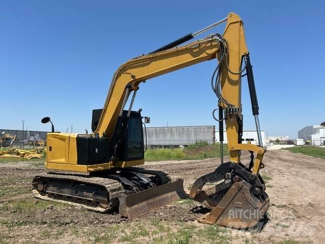 CAT 310 Rupsgraafmachines