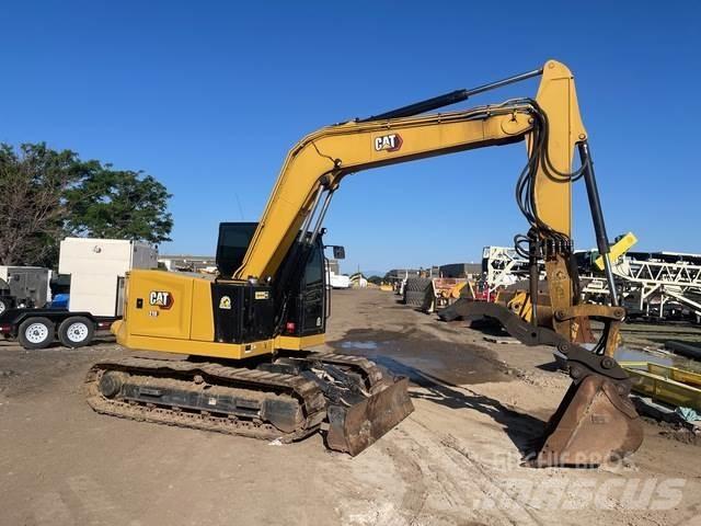 CAT 310 Rupsgraafmachines