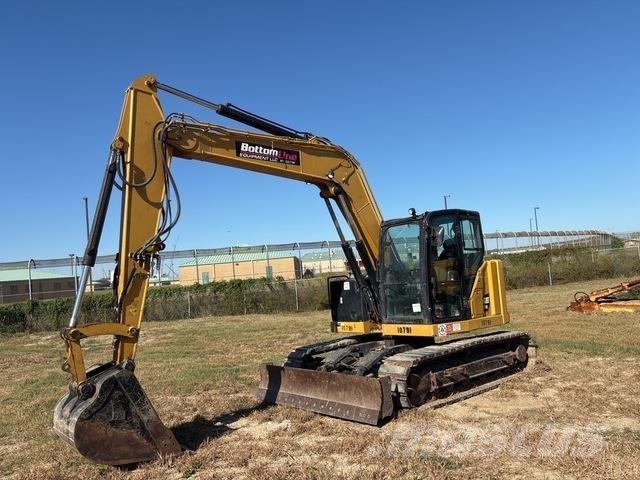 CAT 310 Rupsgraafmachines