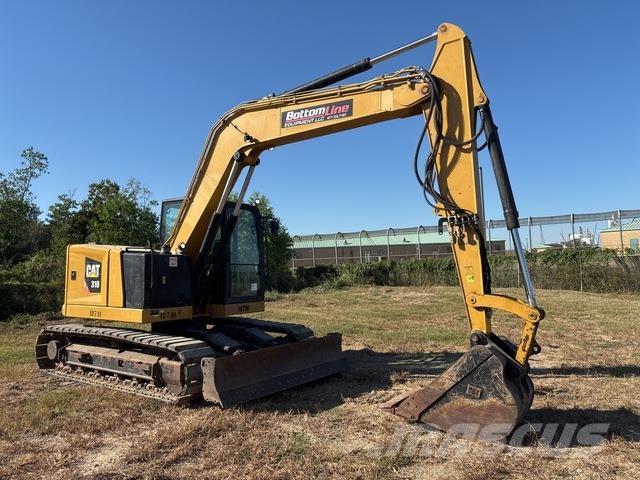CAT 310 Rupsgraafmachines