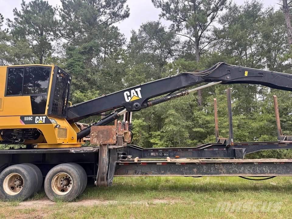 CAT 559C Boomstamladers