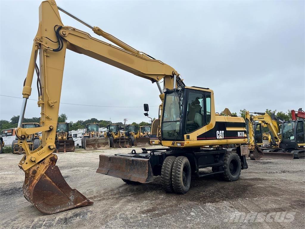 CAT M318 Wielgraafmachines