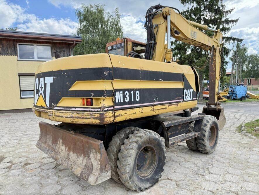 CAT M318 Wielgraafmachines