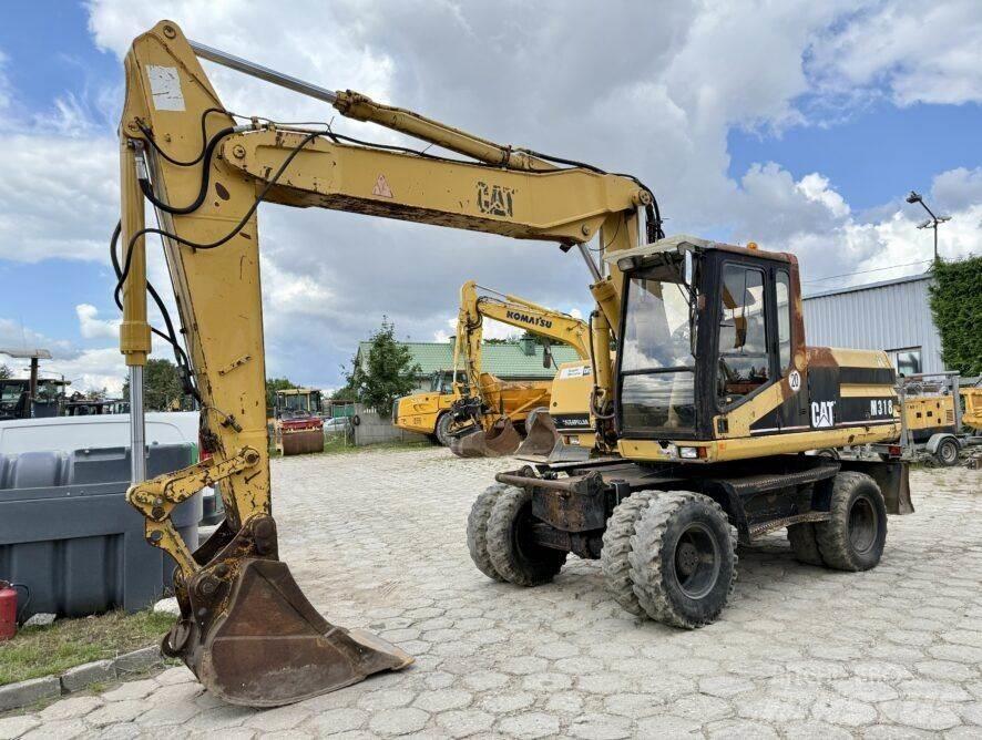 CAT M318 Wielgraafmachines