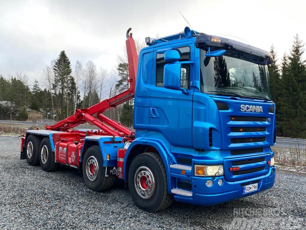 Scania R500 8x4 teliveto, koukkulaite Vrachtwagen met containersysteem